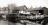 De werf 'De Vlijt' in Aalsmeer met Han de Vries. Op de werf ligt een houten boeier voor onderhoud. Jaartal: 1934 of 1935.
